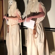Anatole Smith and Keegan Zaporozan performing; masks, costumes, and lighting created by Linnea Balt
